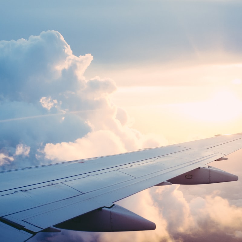 Airplane wing above clouds